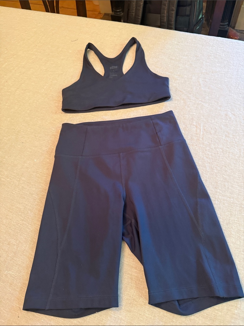 girlfriend collective navy high-waist bike shorts with matching bra